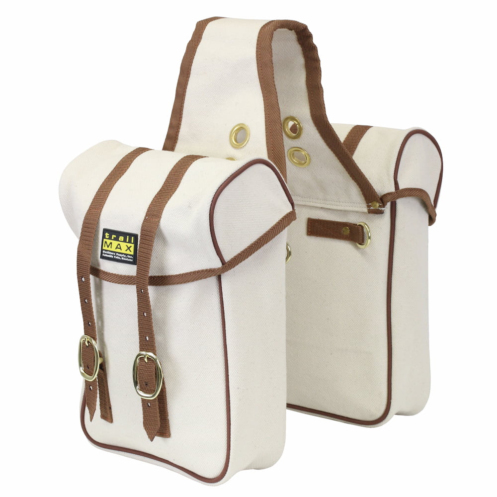 White canvas saddlebags with brown piping and brass hardware, against a white background