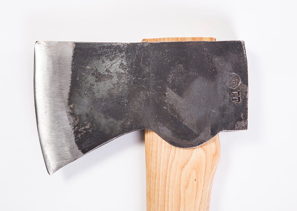 Wooden-handled axe with a large metal head on a white background
