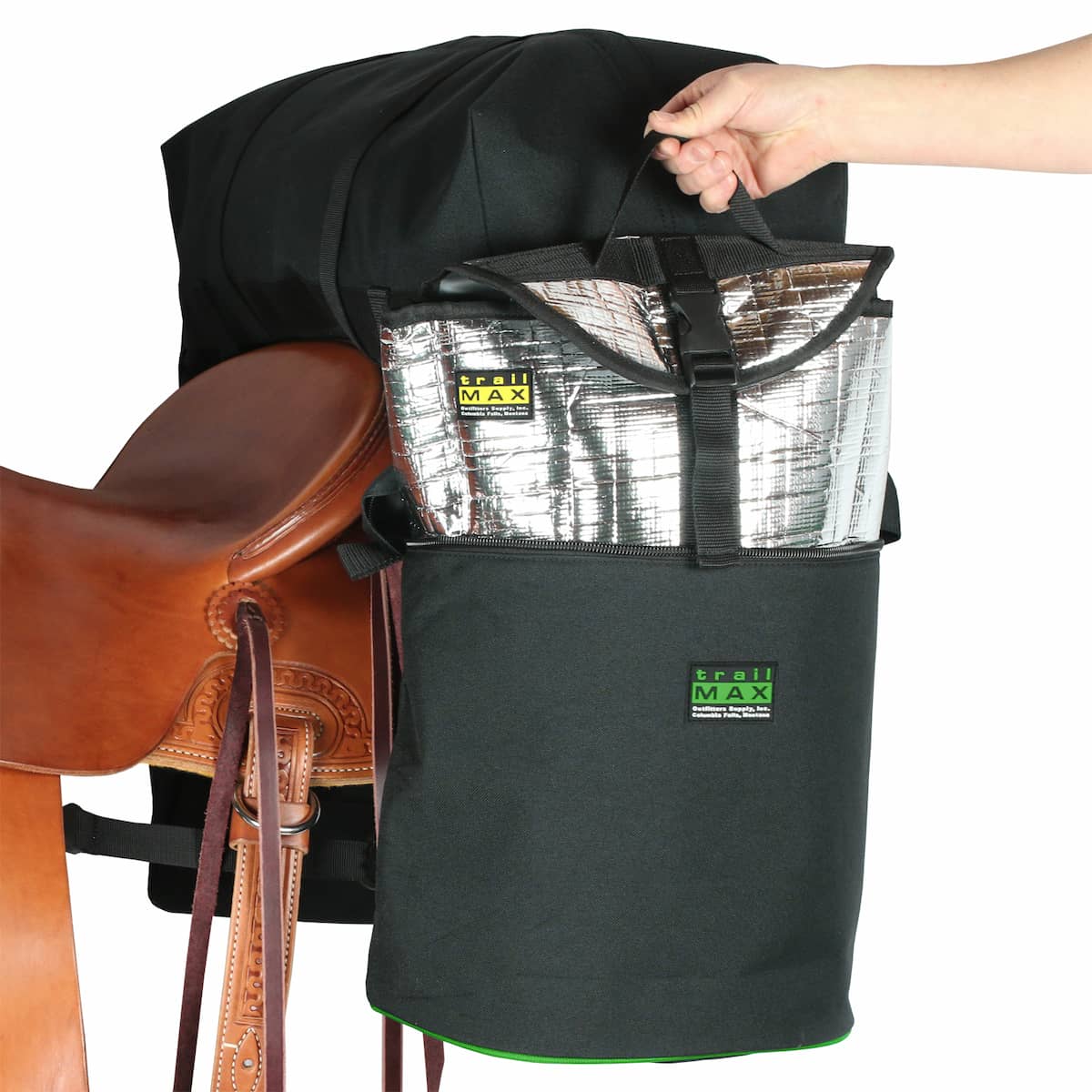 Set of Large TrailMax Saddlebags attached to back of riding saddle with a person's hand shown removing Grab-and-Go liner from one side