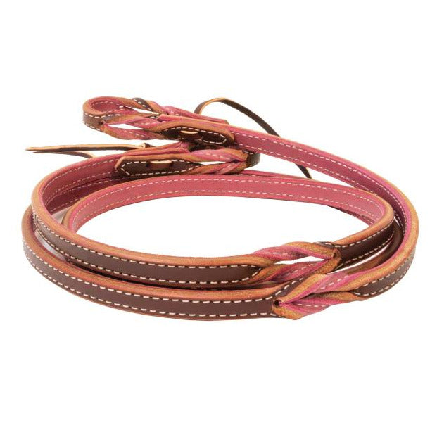 Pink and brown leather pony reins on a white background